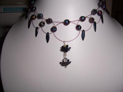 Black Orchid beaded necklaces - A mixture of glass faceted beads, daggers, sterling silver findings and tiger tail. This piece sits well around hte neck and can be changed to sit as a choker or lower on the neck as pictured.  It is a deep purple and the beads although dark all have the AB shine.