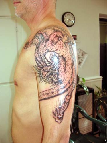 Dragon Tattoo - Black and gray dragon.