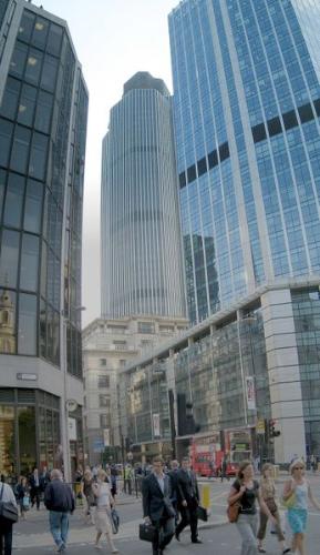 Bishopsgate, in the City of London. - London is a major centre for international business and commerce and is one of three 'command centres' for the global economy (along with New York City and Tokyo).[15]  As Europe's largest city economy, year-by-year, London's economy generates approximately 19% of the UK's GDP[16] or £219 billion in 2005; whilst the entire London metropolitan area generates approximately 30% of UK GDP or £345 billion in 2005.[17]  London shifted to a mostly service-based economy earlier than other European cities, particularly following the Second World War. London's success as a service industry and business centre can be attributed to many factors: English becoming the new lingua franca; its former position as the capital of the British Empire; its close relationship with the US and various countries in Asia; English law being the most important and most used contract law in international business, the multi-cultural infrastructure (schools, places of worship, cultural and social organisations); relatively low taxes, particularly for foreigners (non-UK domiciled residents do not get taxed on their foreign earnings); a business friendly environment (e.g. in the City of London the local government is not elected by the resident population but instead by business - the City of London is a business democracy), good transport infrastructure, particularly its aviation industry and a deregulated economy with little intervention by the government. [citation needed]  Over 85% (3.2 million) of the employed population of greater London works in the services industries. Another half a million employees resident in Greater London work in manufacturing and construction, almost equally divided between both.[citation needed]  London has five major business districts: the City, Westminster, Canary Wharf, Camden & Islington and Lambeth & Southwark.