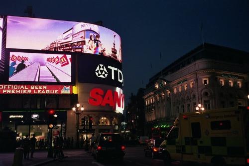Piccadilly Circus at night. - With increasing industrialisation, London's population grew rapidly throughout the 19th and early 20th centuries, and was the most populated city in the world until overtaken by New York in 1925. Its population peaked at 8,615,245 in 1939.  There were an estimated 7,517,700 people living in the Greater London area in mid-2005.[26] However, London's continuous urban area extends beyond the borders of Greater London and was home to 8,278,251 people at the 2001 UK census,[27] whilst its wider metropolitan area has a population of between 12 and 14 million depending on the definition of that area[28] [29]. As per Eurostat, London is the most populous city and metropolitan area of the European Union [30].  The region covers an area of 1,579 square kilometres. The population density is 4,761 people per square kilometres, more than ten times that of any other English region.