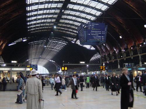 Paddington Station, one of London's main railway t - The centrepiece of the public transport network is the London Underground, the oldest and largest metro system in the world, dating from 1863.[13] The Metro system was home to the world's first underground electric line, the City & South London Railway, which began service in 1890.[41] Nearly 1 billion journeys are made each year on the London Underground system.[42] The Underground serves the central area and most suburbs to the north of the Thames, whilst those to the south are served by an extensive suburban rail network. Commuter and intercity railways generally do not cross the city, instead running into fourteen terminal stations scattered around its historic centre. The London bus network caters for most local journeys and carries even more passengers than the Underground. These internationally recognised buses are the trademark of London transport along with black cabs and the underground. Eurostar trains link London Waterloo station with Lille and Paris in France, and Brussels in Belgium.