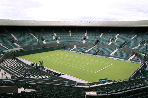 London's Olympic Stadium - London has hosted the Summer Olympics twice, in 1908 and 1948. In July 2005 London was chosen to host the Games in 2012, which will make it the first city in the world to host the Summer Olympics three times.[48] London was also the host of the British Empire Games in 1934.  London's most popular sport (for both participants and spectators) is football.[49] London has 12 League Football clubs, including six in the Premiership (Arsenal, Charlton Athletic, Fulham, Tottenham Hotspur, West Ham United and current Champions Chelsea), plus a further six in the remaining three divisions (Barnet, Brentford, Crystal Palace, Leyton Orient, Millwall and Queens Park Rangers), plus countless non-league and amateur football teams.  London has a unique place in the history of football. In the sixteenth century the headmaster of St Paul's School Richard Mulcaster is credited with taking mob football and transforming it into organised and refereed team football in order to be beneficial for schoolboys. London was home to Ebenezer Cobb Morley who was a founding member of the Football Association in 1862. In 1863, he wrote to Bell's Life newspaper proposing a governing body for football that led to the first meeting at the Freemason's Tavern in central London that created the Football Association, the English governing body of football and the first of its kind anywhere in the world. He wrote at his house in Barnes the first set of rules of true modern football that were adopted by the FA and spread world-wide. It is true to say that Association football (soccer) was invented in London  London also has four rugby union teams in the Guinness Premiership (London Irish, Saracens, Wasps and NEC Harlequins), although only the Harlequins play in London (all the other three now play outside Greater London), as well as a rugby league Super League club in Harlequins RL. London also has many famous other rugby union clubs in lower leagues, including Richmond F.C., Blackheath R.C., Rosslyn Park F.C. and Barnes R.F.C.  Wembley Stadium (which is being rebuilt and is expected to have a capacity of 90,000) has been the home of the English national football team, and serves as the venue for the FA Cup final as well as rugby league's Challenge Cup final. Twickenham Stadium in west London is the national rugby union stadium, and has a capacity of 82,000 now that the new south stand has been completed.  Cricket in London centres on its two Test cricket grounds at Lord's (home of Middlesex CC) in St John's Wood, and The Oval (home of Surrey CC) in Kennington.  One of London's most well-known annual sports competitions is the Wimbledon Tennis Championships, held at the All England Club in the south-western suburb of Wimbledon. Other key events are the annual mass-participation London Marathon which sees some 35,000 runners attempt a 42 km course around the city, and the Oxford vs. Cambridge Boat Race on the River Thames between Putney and Mortlake.