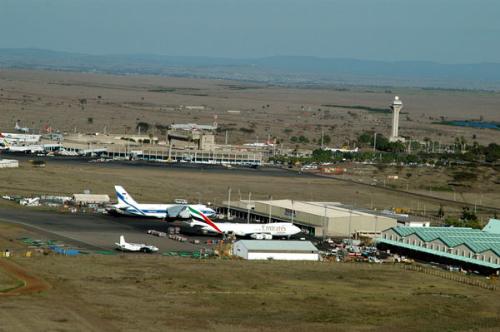 Kenyatta International Airport Aerial - Nairobi is served primarily by Jomo Kenyatta International Airport. It is the largest airport in East and Central Africa and handled over 4 million passengers in 2005. The airport is a major transit hub for passengers flying to East Africa's natural attractions, and other smaller cities in East and Central Africa. The airport is situated 20km from Nairobi's Central Business District, and is served by taxis, shuttle services and coaches. The airport directly serves intercontinental passengers from Europe and Asia.  Wilson Airport is a small, busy airport to the west of Nairobi. It handles small aircraft that generally operate within Kenya, although some offer services to other East African destinations.  Eastleigh Airport was the original landing strip in the pre-jet airline era. It was used in a landing point on the 1930s and 1940s British passenger and mail route from Southampton to Cape Town. This route was served by flying boats between Britain and Kisumu and then by land-based aircraft on the routes to the south. The airport is now a military base.