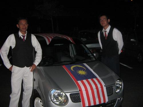 The national flag - That is the national flag of Malaysia on Malaysia national car, Perodua with two Malaysians. But not me.