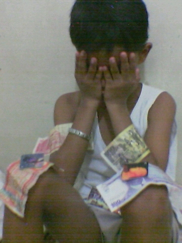 Bribery - This was taken when we made our little cousin to cry then bribed him just to stop crying. We felt guilty then. Realized our mistakes but it made a nice picture out of that experience. I admit, I did wrong, I was bad. Asked forgiveness already. Thankd God, He's forgiving!