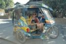 tricycle ride in boracay - a tourist must ride these babies on the way to the White Beach, Boracay after their ferry boat docks at Cagban Jetty port