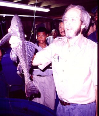 this is a plecostomus.  - this is the type of fish i caught. not the same size as mine, but the same type. the one i caught was about as wide as my shoulders are, so i think i was wrong in my previous estimation of length. i never had the chance to measure it. didn't have a tape measure.