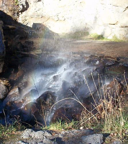 Rainbow  - Here is a rainbow that formed over a natural falls.