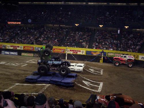 Monster Jam in 2004 - At Reunion Arena in Dallas, my son and my boyfriend went and we watched in this photo Blue Thunder and the Gravedigger square off, jumping four cars at a time, and it looks like the Gravedigger ate it!