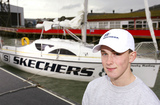 Michael Perham  - Michael Perham poses with his yacht Cheeky Monkey before setting off across the Atlantic Ocean. 
