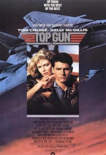 Top Gun - This is the promotional image of the movie Top Gun. The image has the lead actor Tom Cruise and the lead actress Kelly McGillis. As can be seen from the image itself, the movie is about the agression, love and life of a top gun pilto. The image says it all.