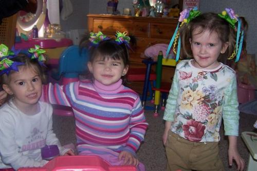 Girls and Bows - My daughter and 2 friend's daughters wearing bows in their hair that I made.