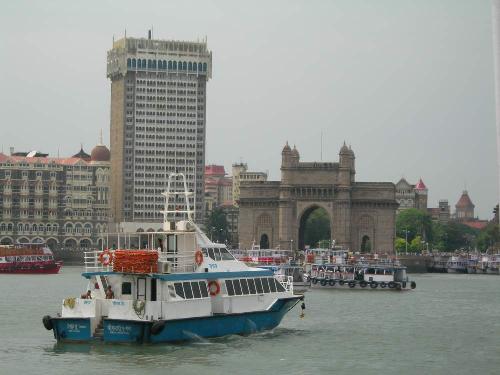 Gateway of india - this was taken from a boat when i was going home..it showas the gateway of india flanked by the tajmahal hotel behind....