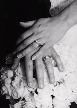 Wedding Rings - Wedding rings on crossed hands