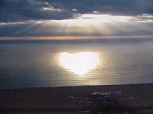 water - this is a picture of a sunset where the sun is in the shape of a heart on the water...purty huh?