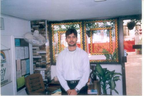 Me at my previous work place - Well this is a photograph of me at my previous workplace (resigned from there recently) it was a high school named headstart. My designation there was building manager!   The background you see is the office that was assigned to me!