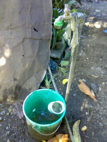 water - the faucet located outside our house where we get water for things in the yard