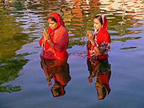 People and Culture - I was visiting a religious gathering just to feel the stunts of religion. The occasion was 'Chhat Puja' (Sun Worshipping) in an remote village in India which is supposed to be held in the first week of November during the new moon. Just before the sun going down the horizon, I caught sight of a cameo of colours which verily tempted me to capture the moment from a very difficult position and angle.