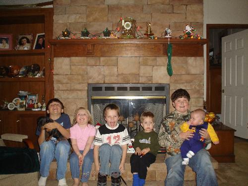 My grandchildren - The second loves of my life Clay holding Bella, Jaden (the only girl), Joseph, McCoy and Cody holding Isack.