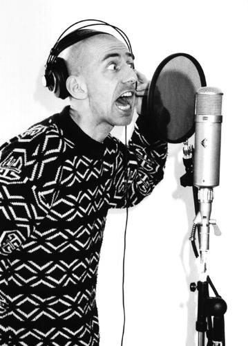 singing - A person singing or recording in a studio.