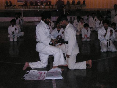 award ceremony - i am getting certificate of 1st degree black belt in shotocan karate