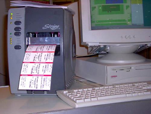 Computer with ticket - this is a ticketing machine